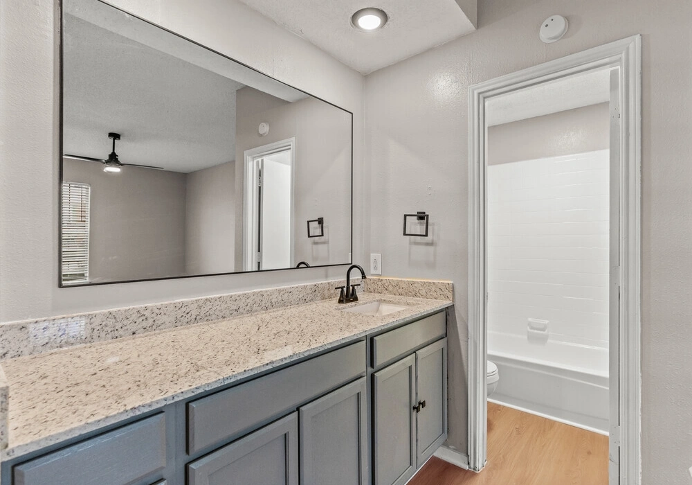 Extended bathroom vanity and dressing mirror